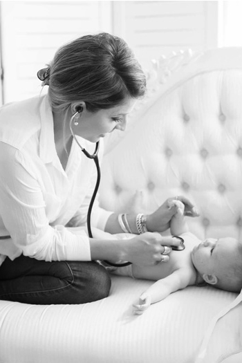 Midwife listening to a baby's heart beat